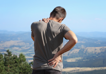 Back Pain After Summer Travel? Here's Why It Happens (And What You Can Do About It)